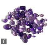 Approximately sixty cut and polished amethysts to include faceted oval, round, cabochon and