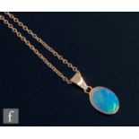 A 9ct oval single stone opal pendant, collar set stone, length 13.5mm, to a 9ct belcher link