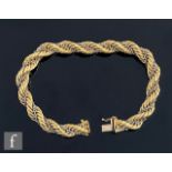 An 18ct rope twist bracelet with intertwined white gold chain detail, weight 30g, length 22cm,