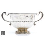 A hallmarked silver pedestal bowl with part fluted decoration and presentation engraving,