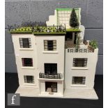A dolls house modelled as an art deco building, eight rooms, three hinged doors to front, roof