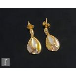 A pair of 18ct drop earrings each with three different coloured mother of pearl pear shaped panels