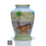A boxed Moorcroft Enamels 'Yorkshire Hare' vase designed by Sian Leeper with a hare running beside a