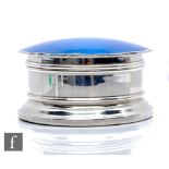 A hallmarked silver and enamel decorated trinket box of shaped circular stepped form, the