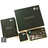 An Elizabeth II 2015 United Kingdom premium proof nickel coin set in teak case with certificate, a