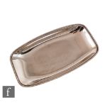 A hallmarked silver cushioned rectangular side dish of plain form, weight 18.5oz, length 31cm,