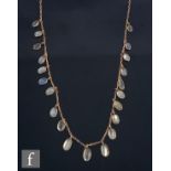 An early 20th Century 9ct graduated moonstone necklet comprising twenty one individually collar