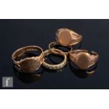 Three 9ct rose gold signet rings, two broken, with a 9ct wedding ring and a 9ct paste set ring,
