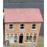 A three storey dolls house modelled as The Bridal Wreath wedding shop, with living quarters above,