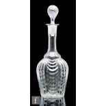 A late 19th Century French three part moulded decanter, of baluster form, the body moulded with