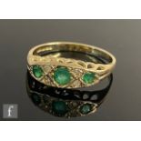 A 9ct hallmarked Edwardian style emerald and diamond seven stone boat shaped ring, weight 1.8g, ring