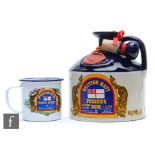 A British Navy Pusser's Rum, 1 litre decanter, sealed with contents, together with Pusser's Rum
