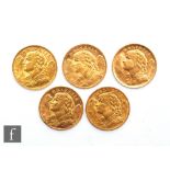 Five Swiss twenty franc coins, all dated 1935. (5)