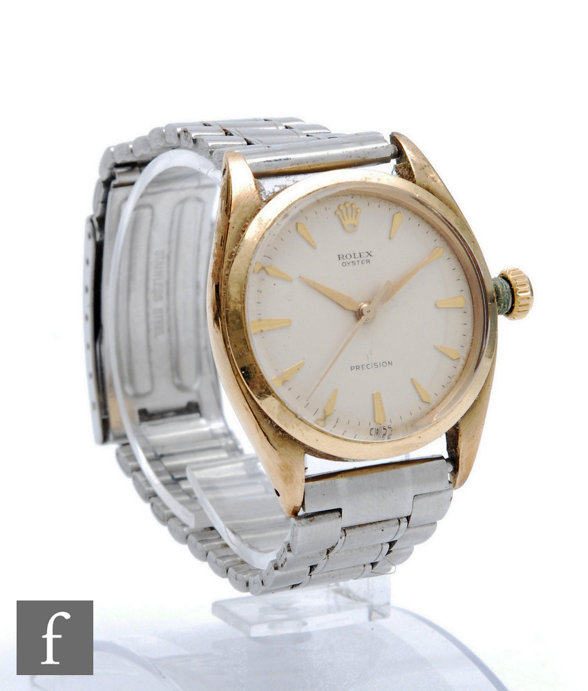 A 9ct hallmarked Rolex Oyster Precision automatic wrist watch with gilt batons to a cream dial, case