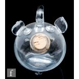 A 1970s Swedish glass spirit decanter formed as a stylised pig, the spherical body with applied