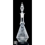 A French glass decanter, circa 1900, the lower part of the stepped conical body acid etched with a