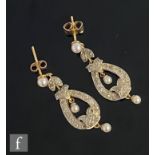 A pair of early 20th Century 18ct diamond drop earrings, pave set tapering oval drops each