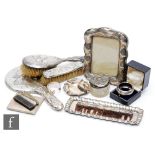 A parcel lot of assorted hallmarked silver items to include two napkin rings, a cigarette case, a