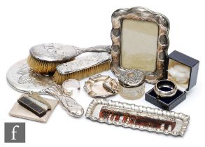 A parcel lot of assorted hallmarked silver items to include two napkin rings, a cigarette case, a