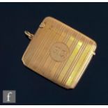 A 9ct hallmarked rectangular vesta case with initials F C within engine turned decoration, weight