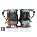 A pair of hallmarked silver baluster half pink tankards of plain form, total weight 13oz, heights