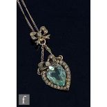 A 19th Century French silver heart shaped pendant with central paste pale blue stone within a