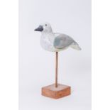 19th Century French School A carved wooden Decoy of a Seabird with original paint an glass eyes,