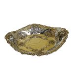 An attractive pierced and embossed oval silver Bon Bon Dish, decorated with lion masks, and floral
