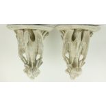 A pair of unusual moulded plaster Wall Brackets, each with a demi-lune shelf supported by a stork,