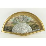 An attractive framed Ladies hand painted silk and mother-o-pearl Fan, depicting Ladies resting by