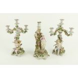 An attractive pair of Sitzendorf porcelain Candelabra, each with three flower encrusted arms and a