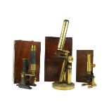 A late 19th Century brass monocular Microscope, in fitted mahogany case, 13" (33cms); together