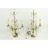 A pair of brass and glass four branch Table Lamps, with lustre drops, 24' (61cms), (an arm as