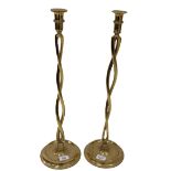A pair of early and unusual twisted Candlesticks, on bowl shaped circular bases, approx. 59cms (23")