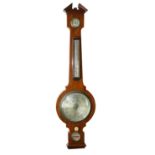 A late 19th Century mahogany Wheel Barometer, by Negretti & Zambra, with divided pediment over three