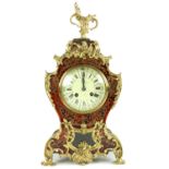 A fine quality French Mantel Clock, with boulle case and overall ormolu rococo mounts with pierced