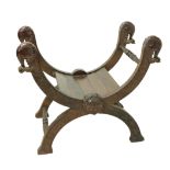 An early heavy 20th Century Oriental carved hardwood X frame Chair, the four carved elephant head