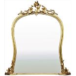A Victorian giltwood shaped Overmantel, the top surmounted by ivy leaves and scrolls, moulded border