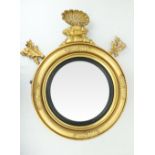 An Irish Georgian giltwood circular convex Overmantel Mirror, in the manner of Del Vecchio, with