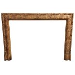 A good quality leaf carved pine Fire Surround, the frieze and jamb profusely carved with scrolling