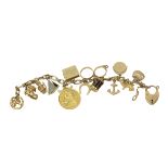 An attractive antique 9ct gold Charm Bracelet, with classic curb link gold bracelet with fourteen