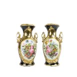 An attractive pair of 19th Century French dark blue and parcel gilt porcelain Vases, each with two