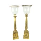 An attractive pair of gilt and cast brass tall Candle Lanterns, each with a glass shade on a