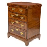 A George III style mahogany Bachelors Chest, with crossbanded lift top over two short and three long