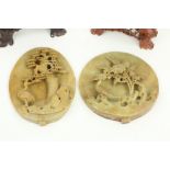 Two Chinese carved soapstone Panels, one round carved with bird and flower, on separate carved and