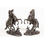 After Guillaume Coustou  A pair of bronze Marley Horse Groups, 16" (41cms). (2)