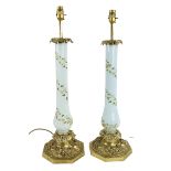 A good pair of leaf cast brass Table Lamps, with light blue baluster glass stems decorated with