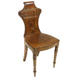 A George IV mahogany Hall Chair, with panelled back with oval centre above a solid seat on front