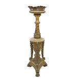 A giltwood Georgian style Torchere, with floral decoration and drapes on a triform base with paw