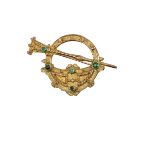 An attractive 9ct gold Ladies Brooch, of small proportions modelled as the "Tara" Brooch with varied